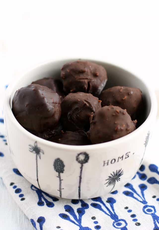 chocolate coconut candies in a white bowl