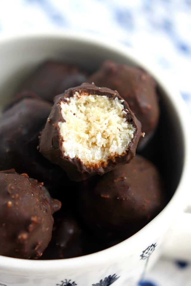 closeup of chocolate coconut candy in a white bowl