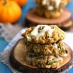 Soft and chewy gluten free and vegan pumpkin oatmeal cookies are topped with a white chocolate glaze. Delicious! #ad