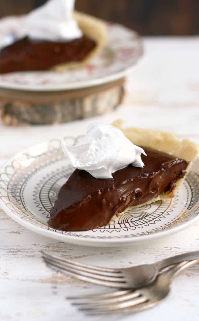 gluten free chocolate pie on small plates with two forks