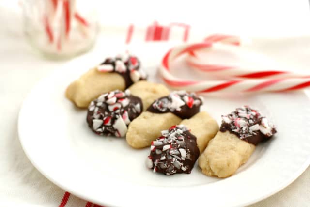 chocolate dipped shortbread cookies on a white plate