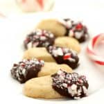Buttery shortbread cookies are dipped in chocolate and candy canes for a festive treat!