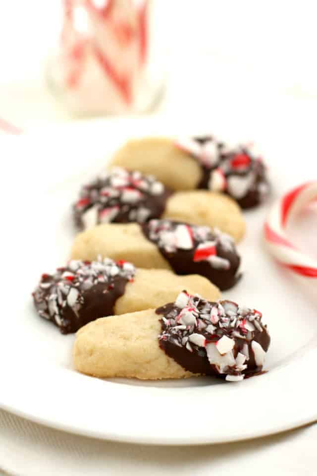 chocolate dipped shortbread cookies on a white plate