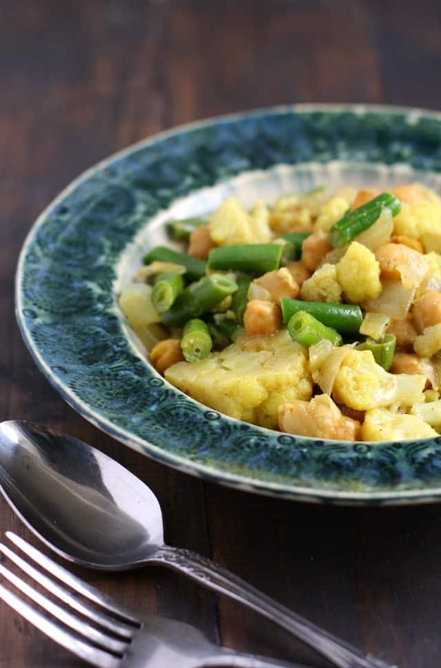 Cozy and comforting green bean and cauliflower curry is an easy meal option that's vegan and allergy friendly!