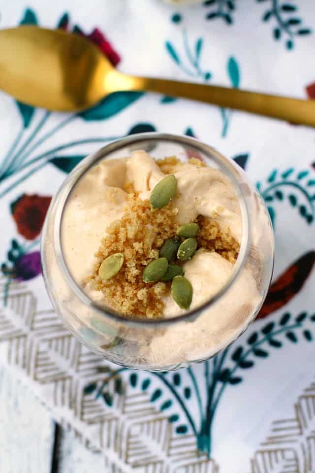 dairy free gluten free pumpkin mousse topped with pumpkin seed in a glass