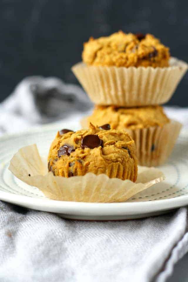 dairy free pumpkin chocolate chip muffins on a white plate