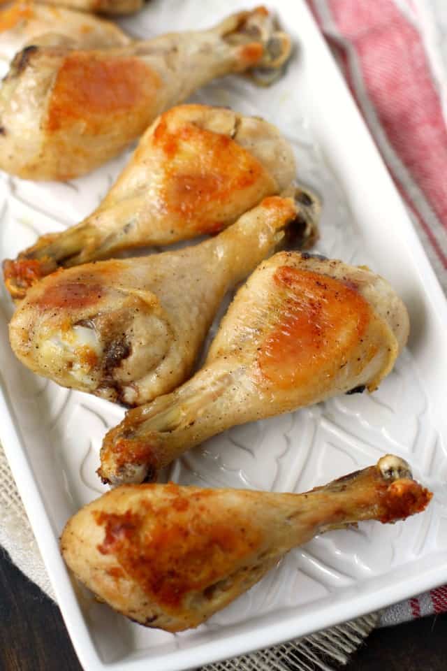 oven roasted chicken legs on a white tray