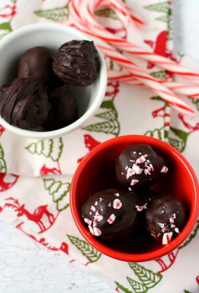 chocolate cookie truffle balls in red and white bowls