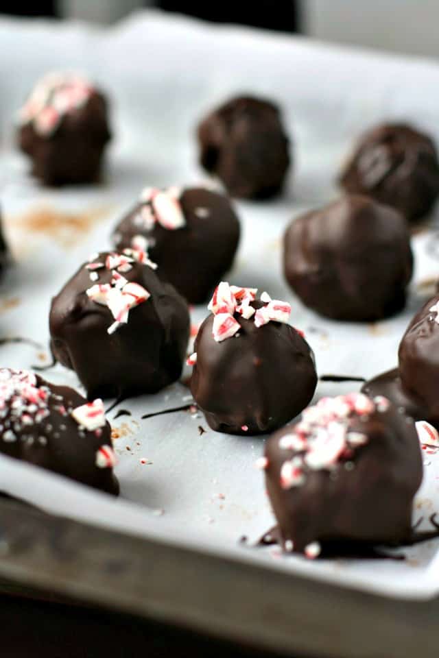 double chocolate covered cookie truffles on a silver cookie sheet