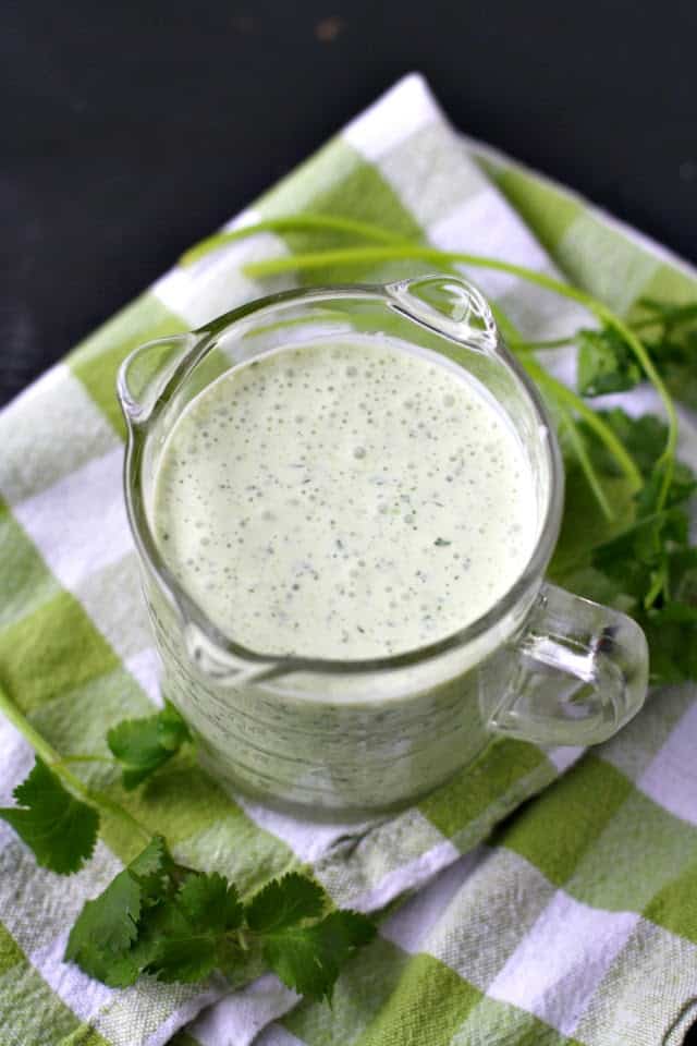 dairy free creamy cilantro dressing in a glass container