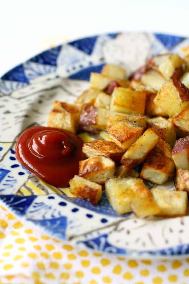 easy roasted red potatoes with ketchup on a plate