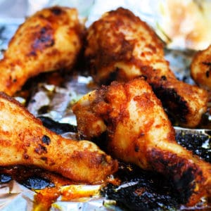 seasoned chicken legs on the grill