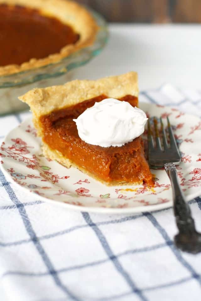slice of vegan pumpkin pie with a bite taken out of it