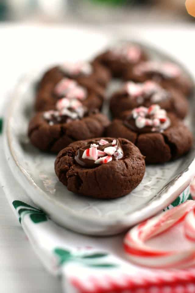 chocolate peppermint thumbprint cookies on a ceramic tray