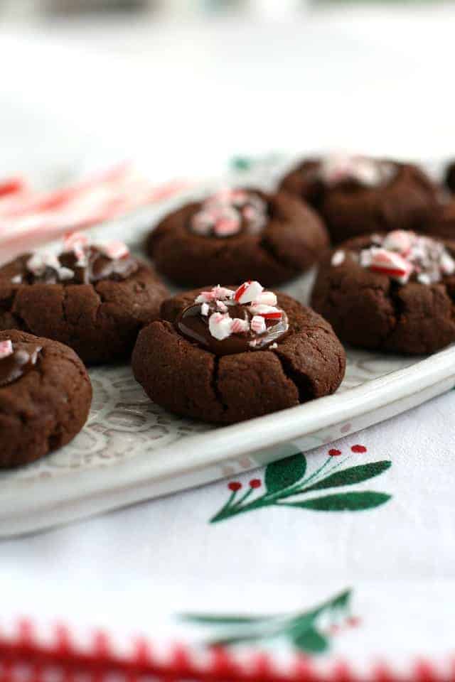 gluten free chocolate peppermint thumbprint cookies on a white tray