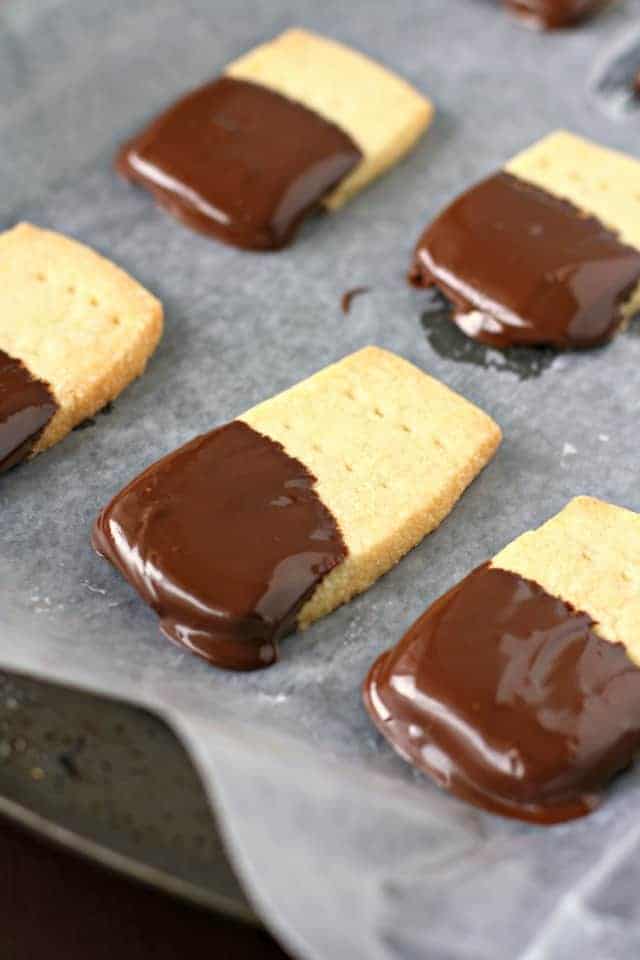 chocolate covered shortbread cookies on cookie sheet