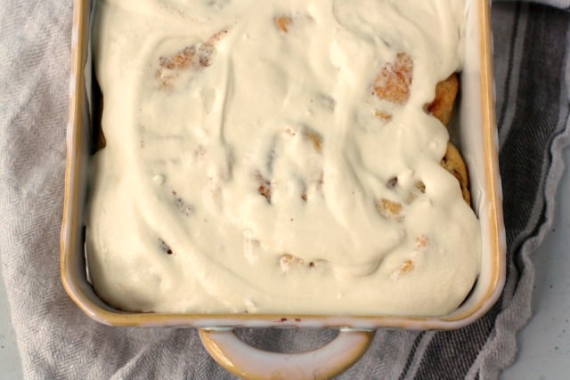 frosted cinnamon rolls in pan