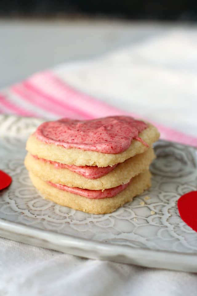 stack of sugar cookies with frosting