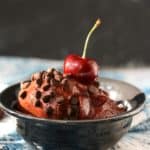 cherry chocolate nice cream in a black bowl