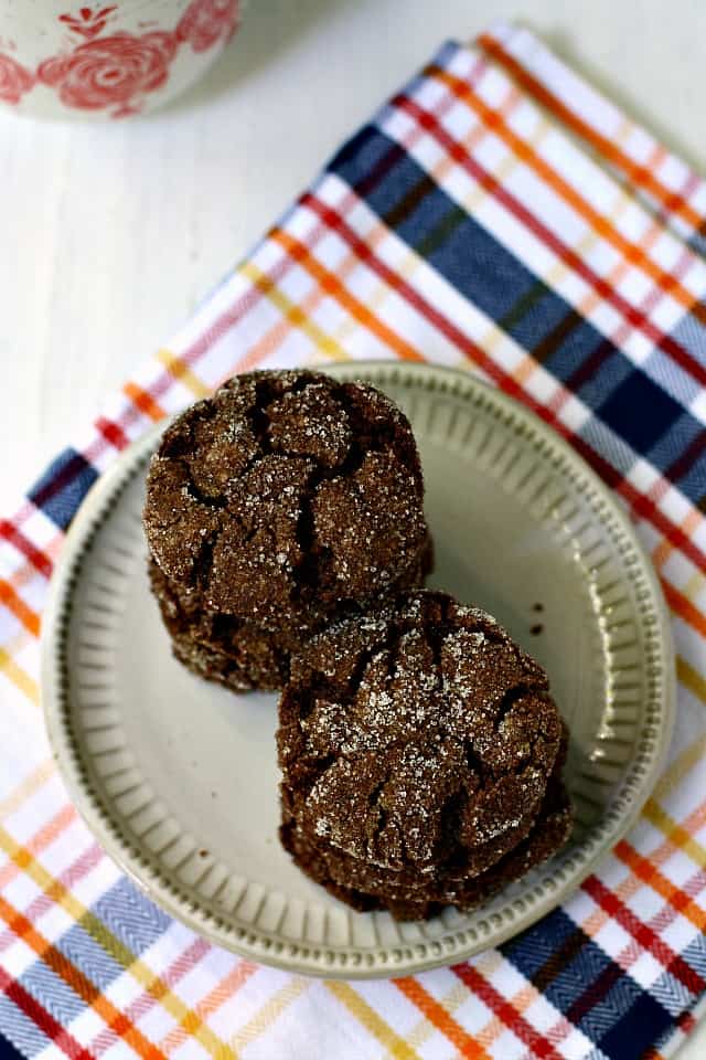 gluten free sunbutter crinkle cookies on a white plate and plaid napkin