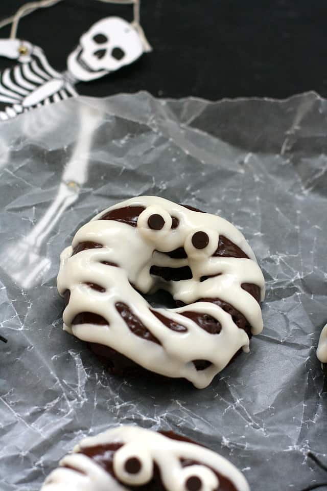 vegan halloween donuts on a piece of waxed paper