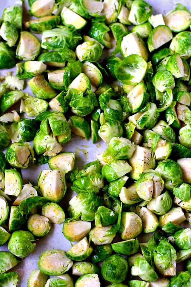 raw brussels sprouts on a cookie sheet