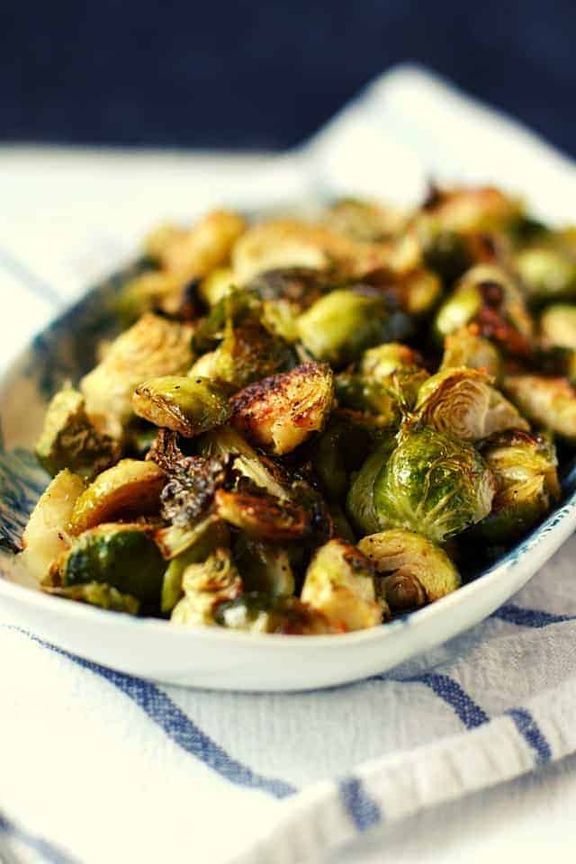 roasted brussels sprouts on a white platter