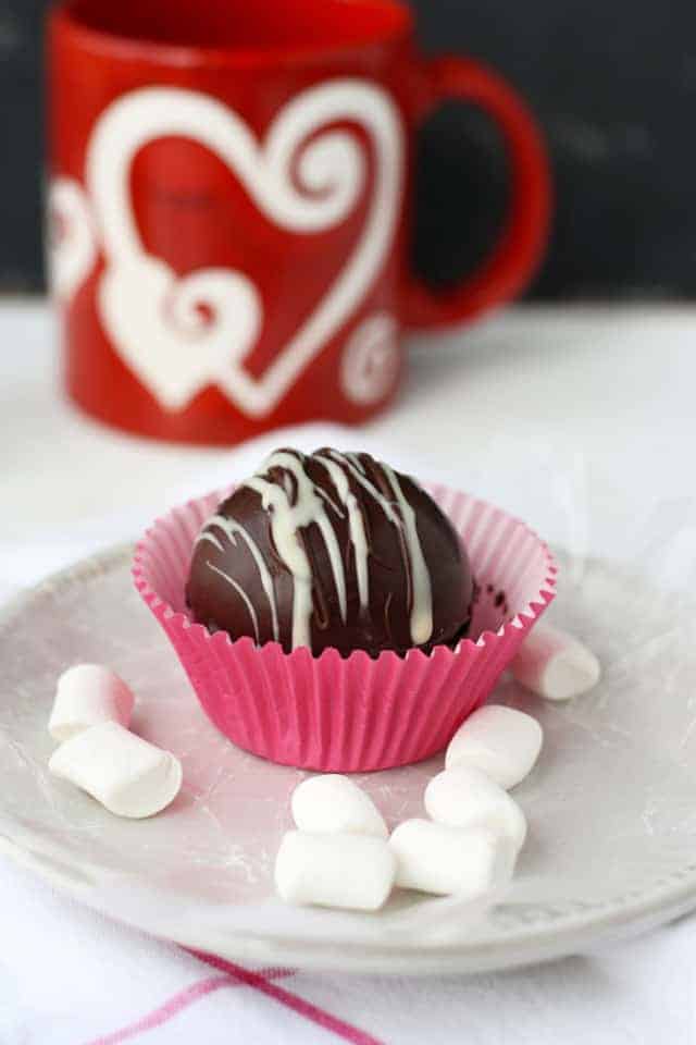 vegan hot chocolate bomb in a pink cupcake wrapper