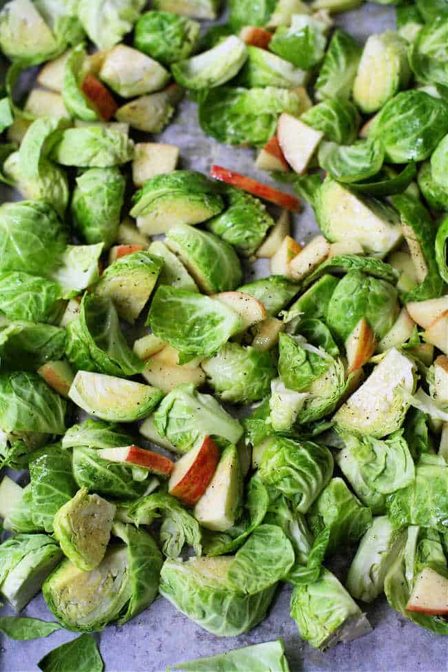 uncooked brussels sprouts and apples