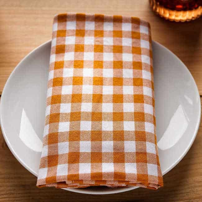 dinner plate with checkered napkin