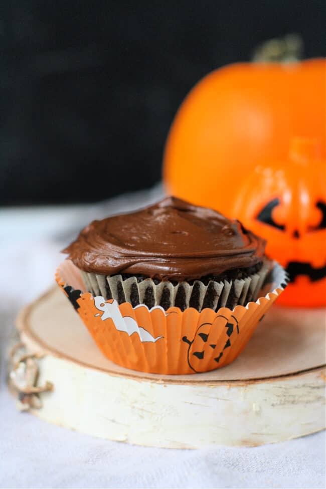 double chocolate vegan cupcake with a halloween wrapper
