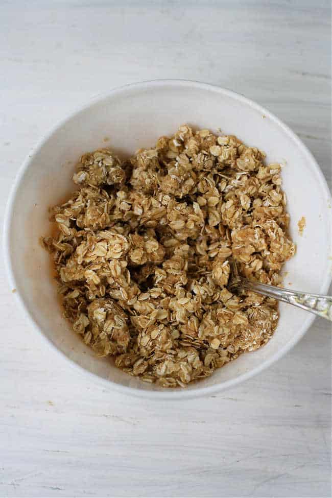 oat and sugar topping in a white bowl