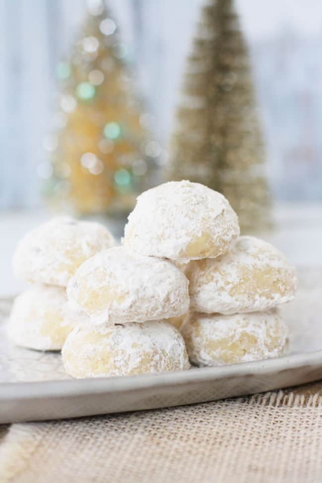 stack of vegan snowball cookies on a white tray