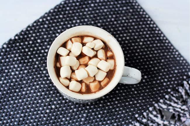 dairy free hot chocolate in a white mug with mini marshmallows