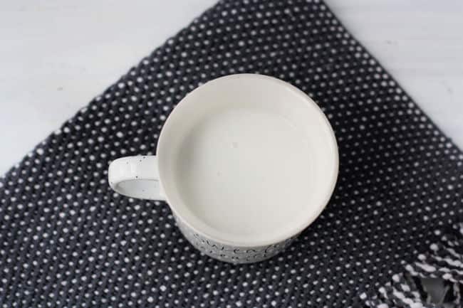 dairy free milk in a white mug