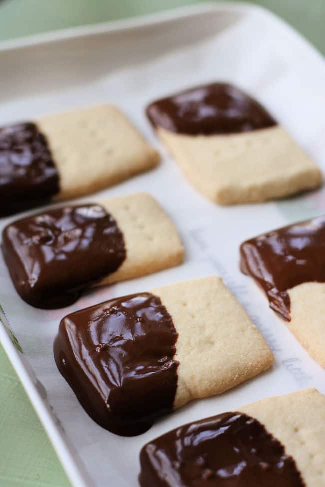 chocolate dipped gluten free butter cookies on a tray