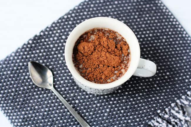 mug with milk and cocoa powder