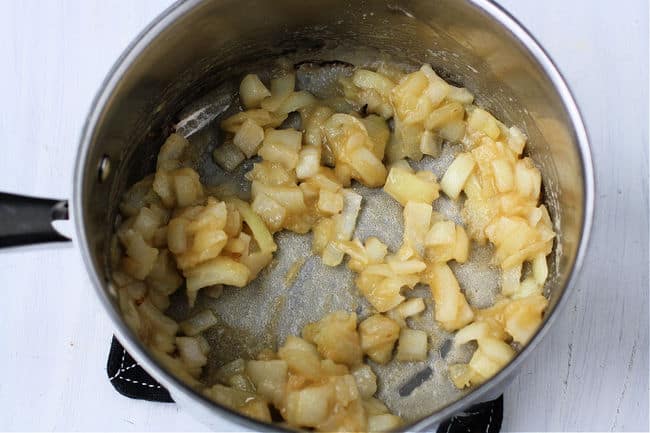 chopped onions in a pan with butter and flour