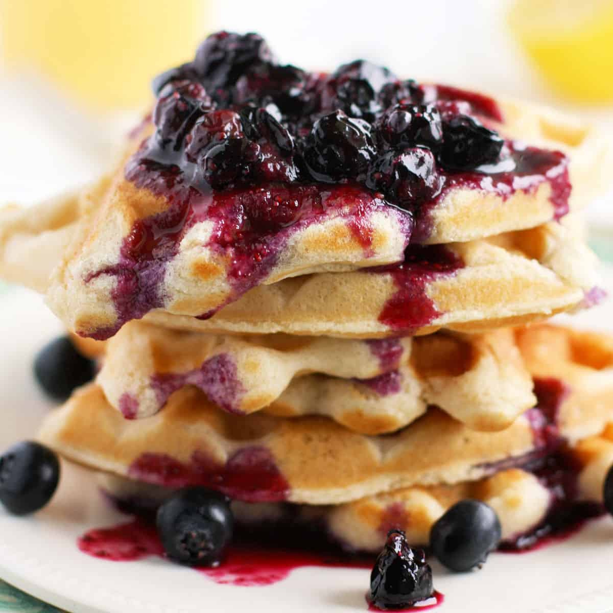 Light and Fluffy Vegan Waffles with Blueberry Sauce. - The Pretty Bee