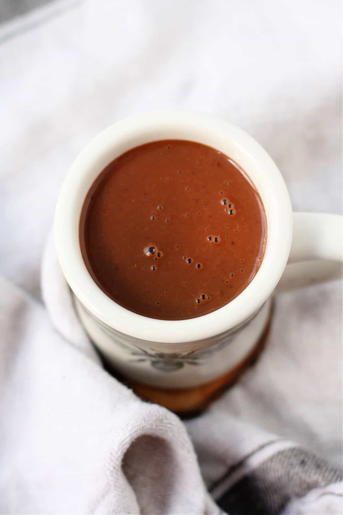dairy free coconut cream hot chocolate in a white mug