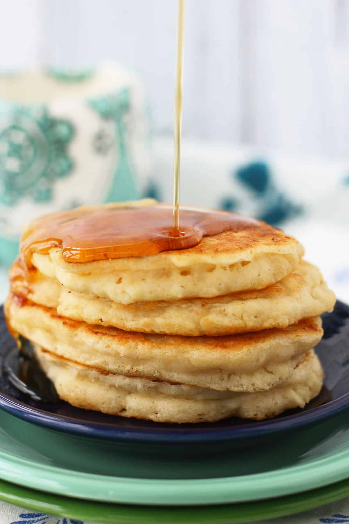 stack of vegan pancakes with syrup