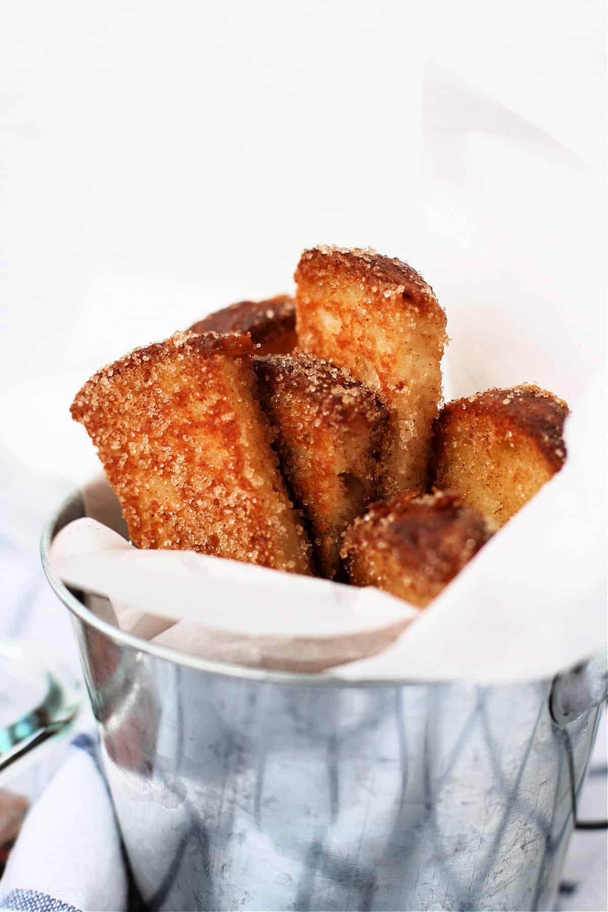 vegan cinnamon french toast sticks in a silver pail