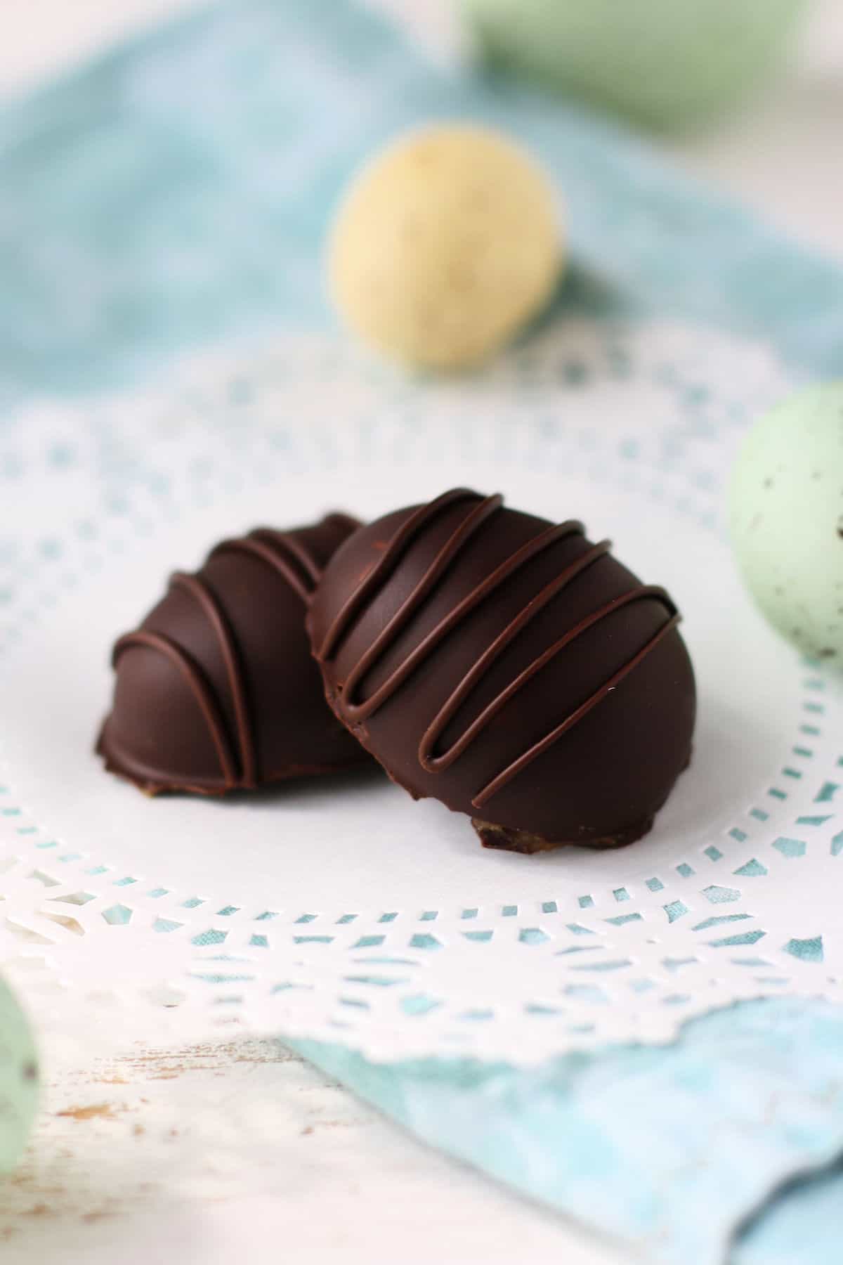 chocolate covered caramel easter egg candy on a doily