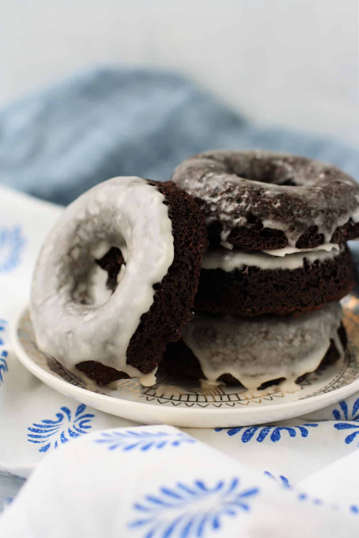 chocolate donuts without eggs or dairy on a white plate
