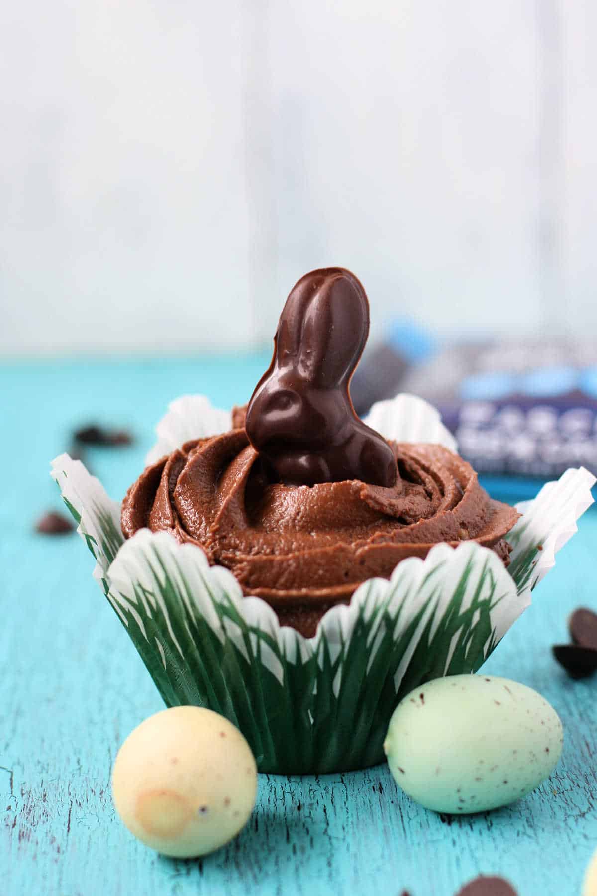gluten free vegan chocolate easter cupcakes surrounded by plastic eggs