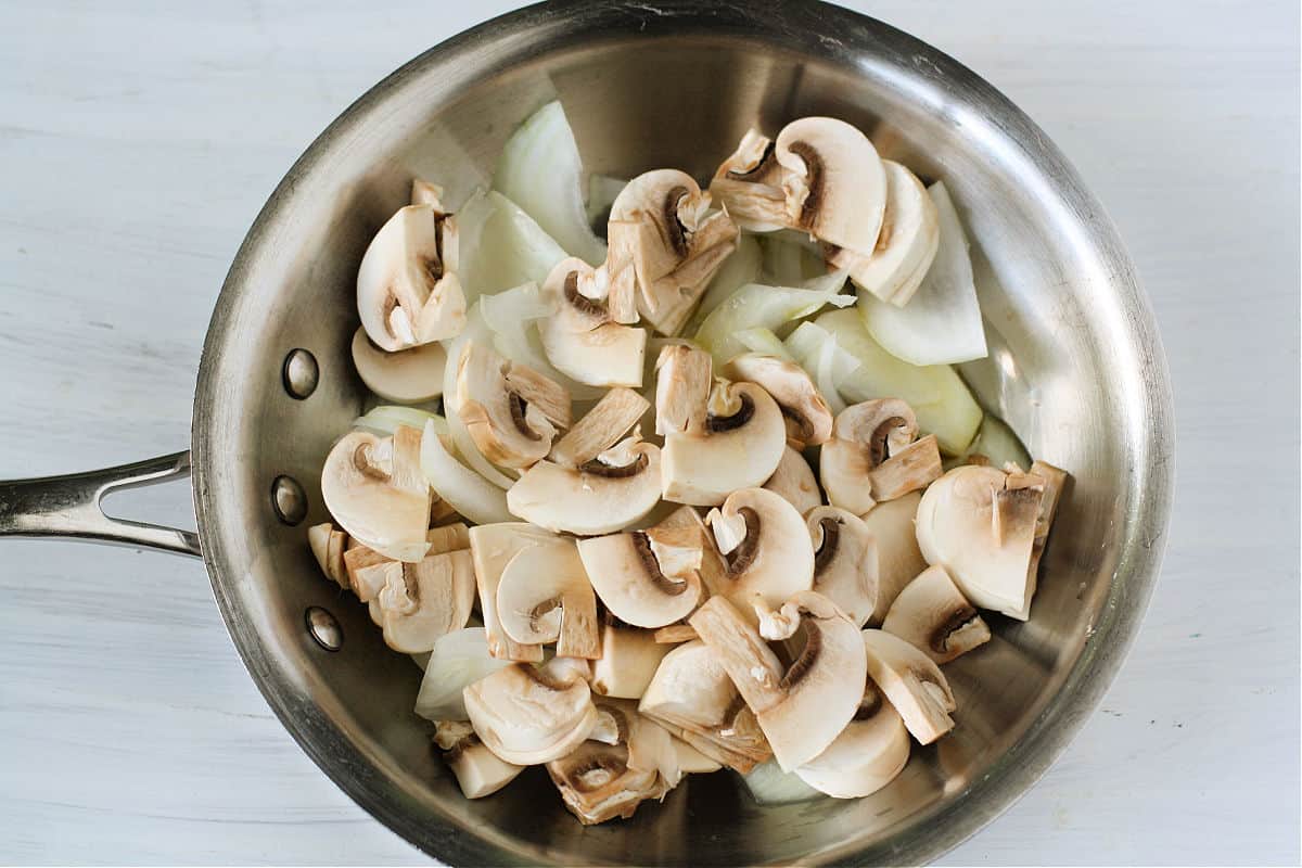 mushrooms and onions in frying pan