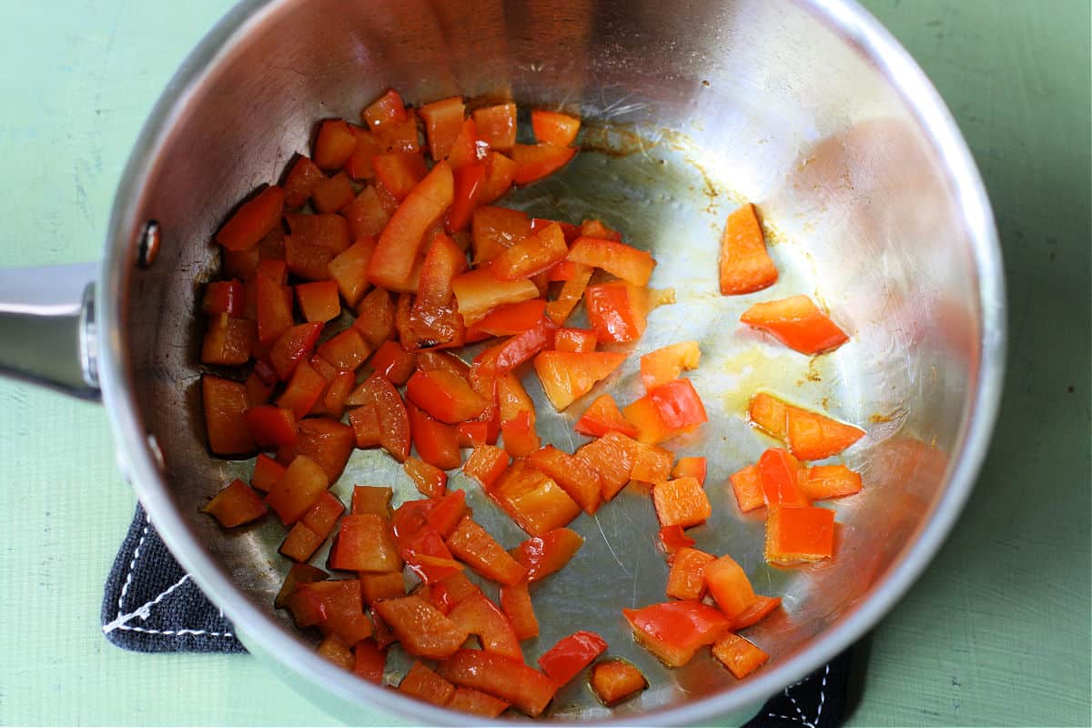 cooking red pepper in a pan