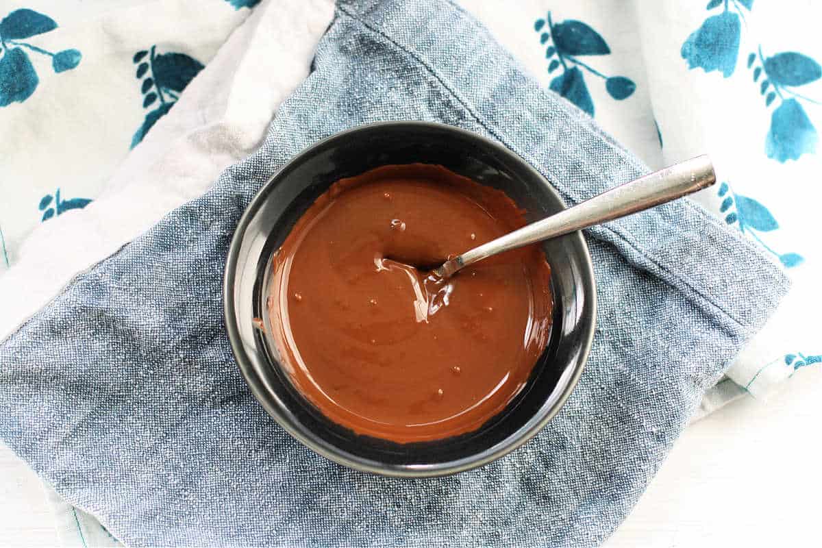 vegan chocolate sauce in a small bowl