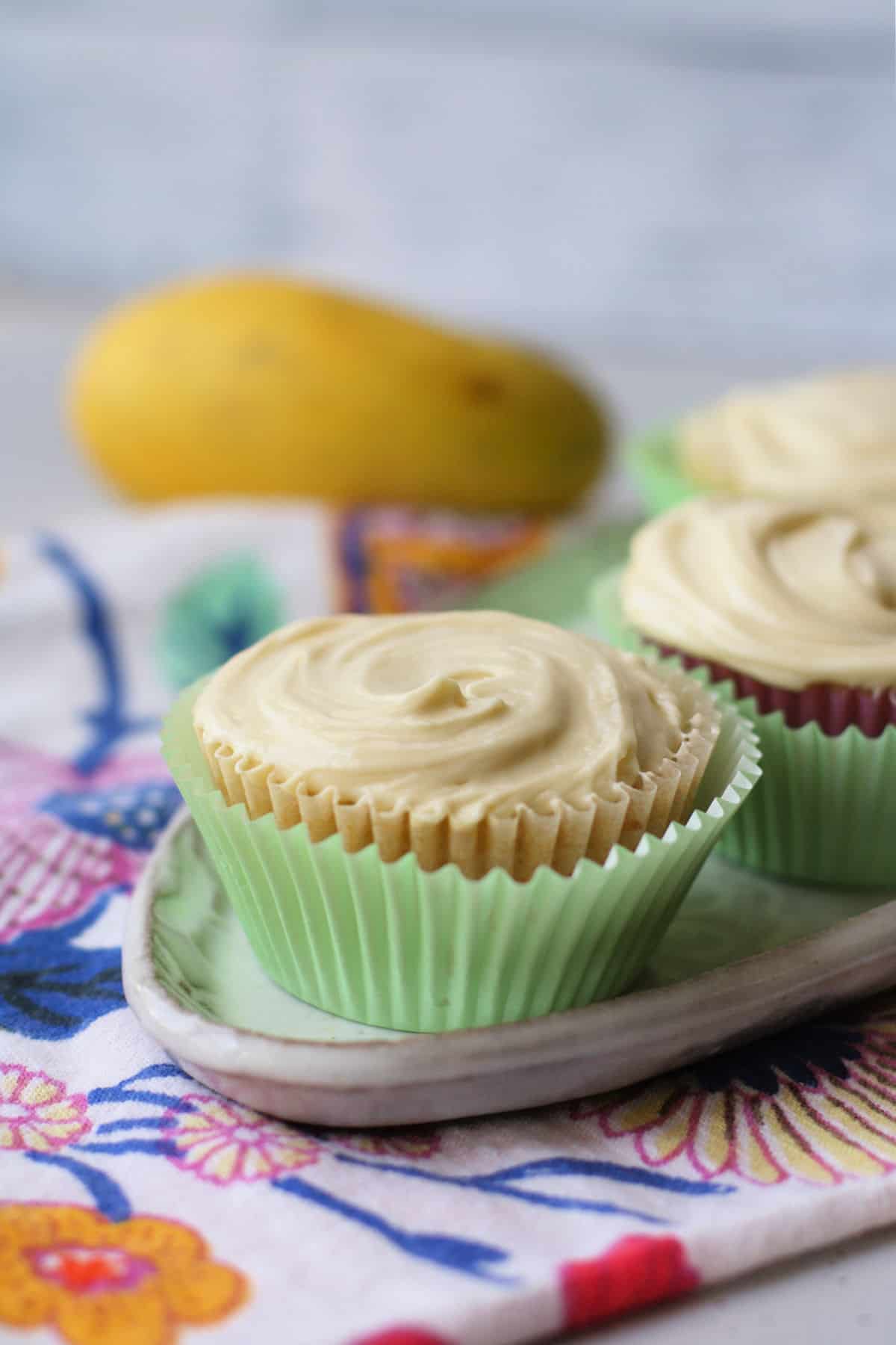 vegan vanilla cupcakes with mango frosting