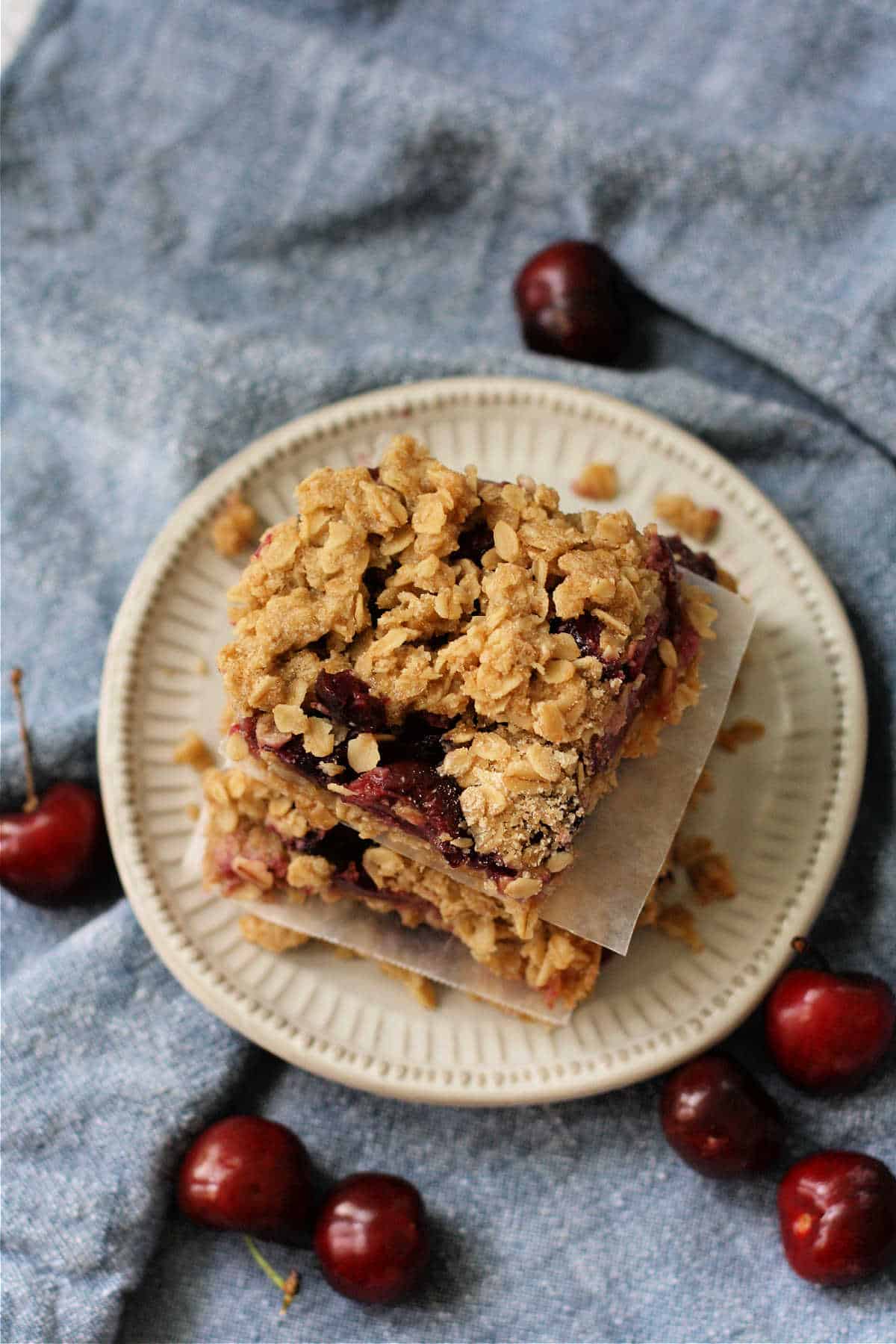 gluten free cherry crumble bars on a white plate
